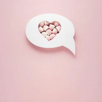 Creative valentines concept photo of comic cloud with heart and sweets on pink Stock Photos