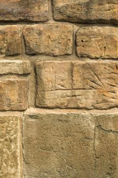 Creative vertical dark beige background from a ragged and scratched front fac Stock Photos