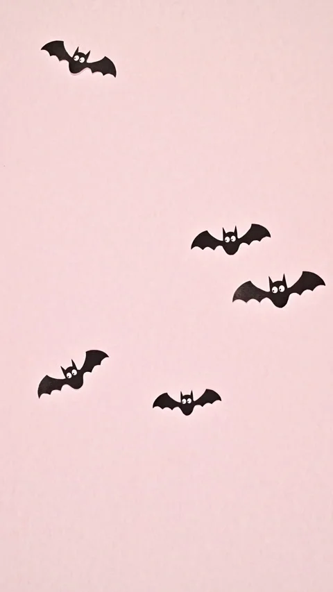 Creative vertical Stop motion Happy Halloween bats fly on pastel pin background. Stock Footage 283265827