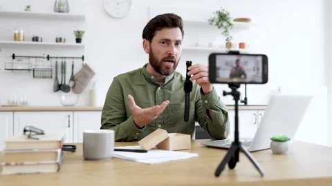 Creative vlogger recording video of new watch unpacking Stock Footage 253339265