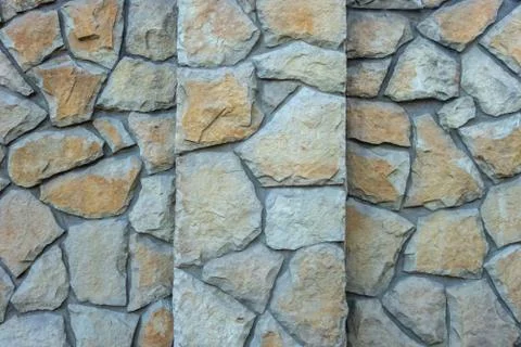 A creative wall made of natural stone. Brown vintage background. Stock Illustration