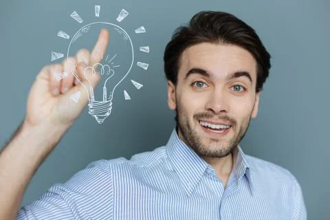 Creative web developer feeling happy while getting an unusual idea Stock Photos