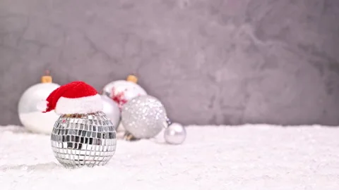 A Creative White and Silver Christmas Arrangement of Ornaments Appear Stock-Footage 253754265