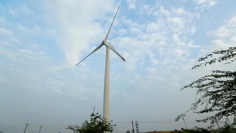 Creative Wind Turbine Against Blue Sky for Renewable Energy in India Stock Footage 341386462