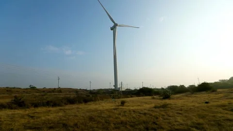 Creative Wind Turbine Against Blue Sky for Renewable Energy in India Stock Footage 341386573