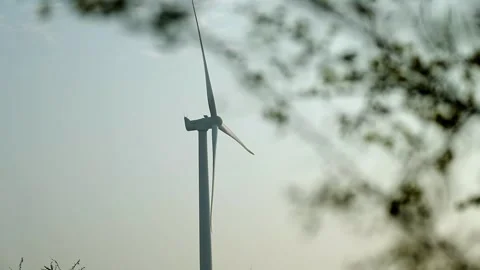 Creative Wind Turbine Against Blue Sky for Renewable Energy in India Stock Footage 341386675