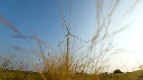Creative Wind Turbine Against Blue Sky for Renewable Energy in India Stock Footage 341386682
