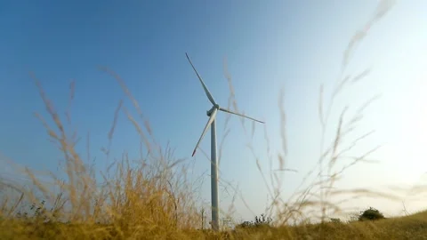 Creative Wind Turbine Against Blue Sky for Renewable Energy in India Stock Footage 341386708