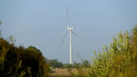 Creative Wind Turbine Against Blue Sky for Renewable Energy in India Stock Footage 341386719