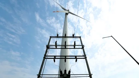 Creative Wind Turbine Against Blue Sky for Renewable Energy in India Stock Footage 341386783