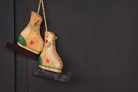 Creative winter composition with decorative toy skates Stock Photos