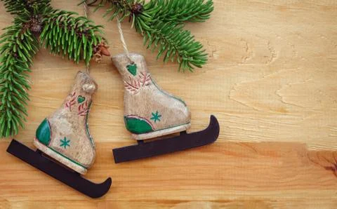 Creative winter composition with decorative toy skates Stock Photos