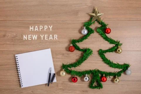 Creative winter layout made with evergreen tree branches and ornament on wood Stock Photos