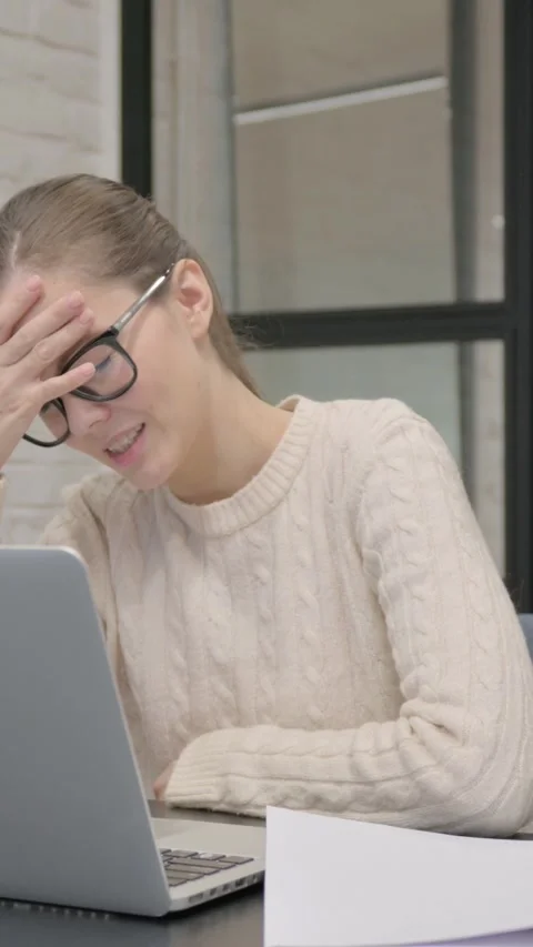 Creative Woman Feeling Upset while Reading Contract at Work, vertical video Video stock 325831821