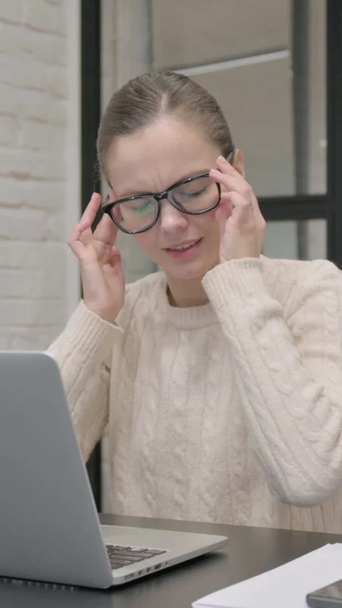 Creative Woman having Headache at Work, vertical video Stock Footage 325831289