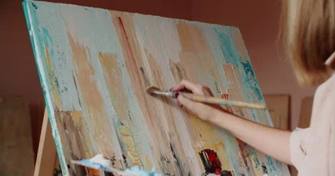 Creative woman painter working in studio painting picture oil paint using brush. Video stock 242492041
