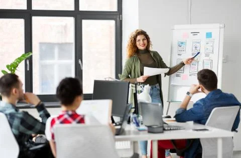Creative woman showing user interface at office 스톡 사진
