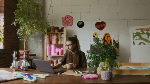 Creative Woman using Computer at Table in Rug Tufting Studio Stock Footage 316492132