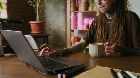 Creative Woman using Computer with Tattooed Hands Typing Stock Footage 316493458