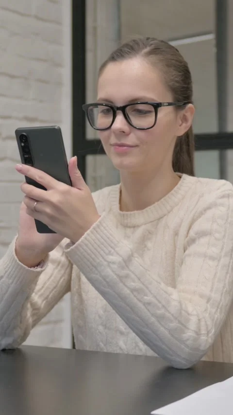 Creative Woman Using Phone at Work, vertical video 動画素材 325832164