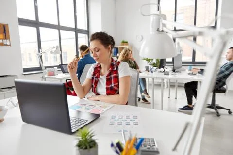 Creative woman working on user interface at office Foto stock