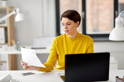 Creative woman working on user interface at office Stockfoto's