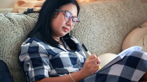 Creative woman writing a note idea in a book Stock Footage 91349706