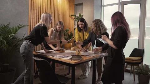 Creative women's team is working on a landscaping project in an office Stock Footage 223102472