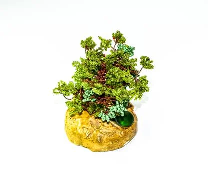 Creative wood made of copper wire and beads. Fotos Stock