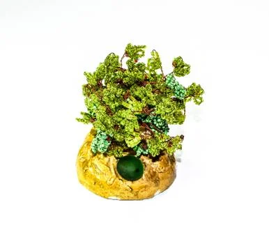 Creative wood made of copper wire and beads. Stock Photos