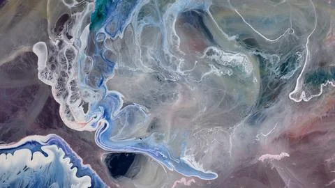 Creative work with alcohol ink and epoxy resin in a bright studio setting Stock Photos