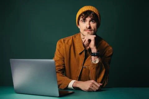 Creative work begins with a man using a laptop in the studio Stock Photos