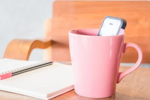 Creative work table with notepaper and mobile phone Stock Photos