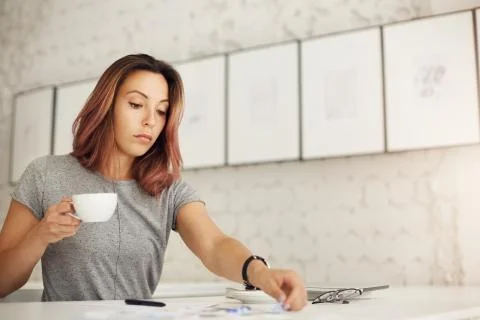 Creative worker doing her daily job drinking coffee resting from her Stock Photos