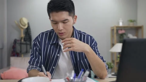 Creative worker propping head and tapping Stock Footage 153067731