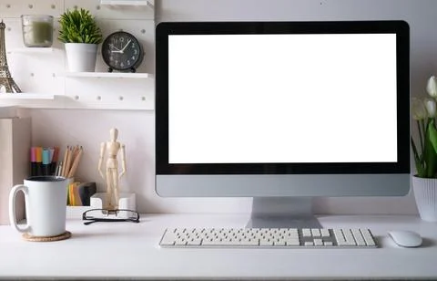 Creative workplace with computer, coffee cup, pencil holder and houseplant .. Stock Photos