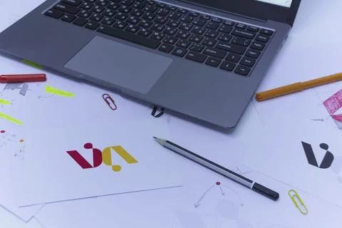 Creative workplace of a Graphic Designer. Development of a logo for the compa Stock Photos