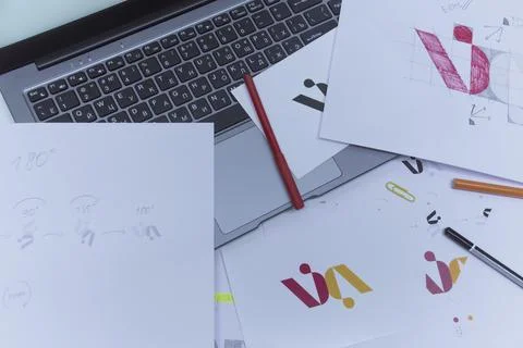 Creative workplace of a Graphic Designer. Development of a logo for the compa Stock Photos