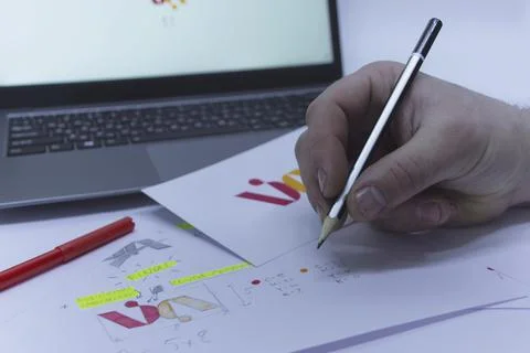 Creative workplace of a Graphic Designer. A man in the office is developing a Stock Photos