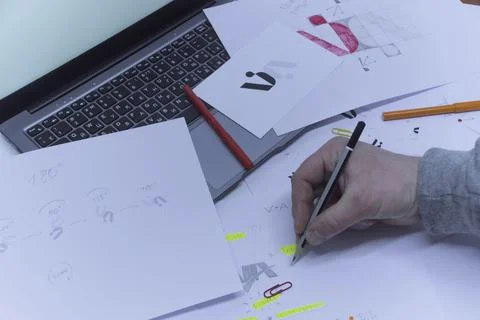 Creative workplace of a Graphic Designer. A man in the office is developing a Stock Photos