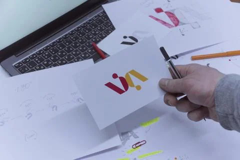 Creative workplace of a Graphic Designer. A man in the office is developing a Stock Photos