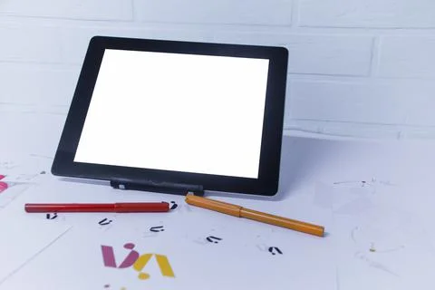 Creative workplace of a Graphic Designer with Tablet. Development of a logo f Stock Photos