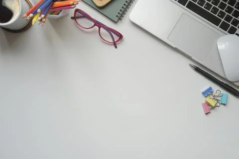 Creative workplace with laptop computer, glasses, coffee cup and supplies on  Foto stock