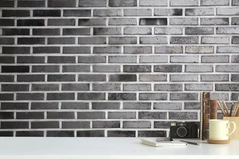 Creative workplace with retro camera, coffee cup and stationery on white tabl Foto stock