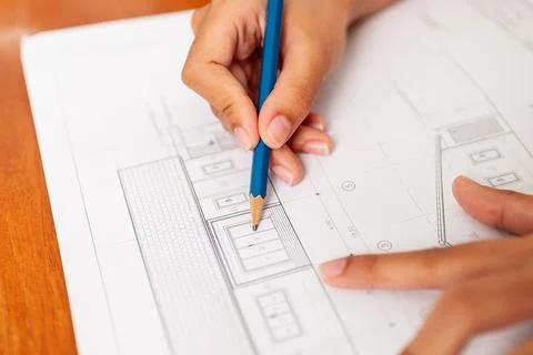 Creative workspace for architectural plans close-up technical drawing and d.. 写真素材