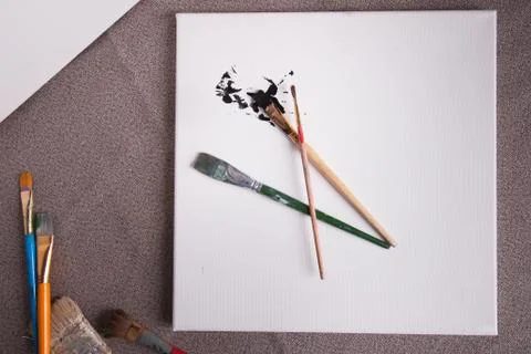 Creative workspace for artists paint brushes and canvas Stock Photos