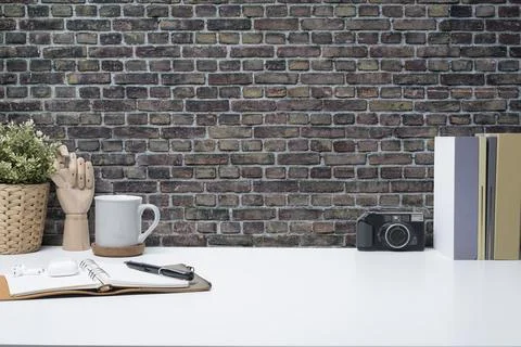 Creative workspace with camera, coffee cup, notebook and houseplant on whit.. Stock Photos