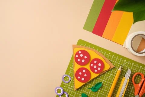 Creative workspace with colorful paper, scissors, and pencil for art projects Stock Photos