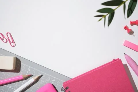 Creative workspace with cutting mat, pink notebook, pencils, pen and statione Stock Photos