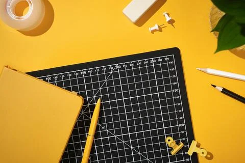 Creative workspace with cutting mat, stationery, notebook, pencils and offi.. 스톡 사진